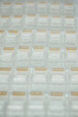 Zenithal view of RJ 45 network connectors, network concept, structured cable, product photography. selective focus