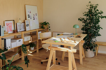 Creative desk in bright and sunny studio
