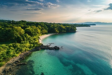 Obraz premium Secluded cove with pristine beach and turquoise water.