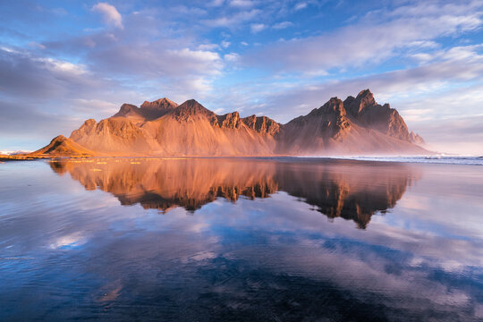 Perfect reflection of Vestrahorn on the beach