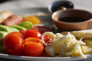 Fresh Mediterranean Platter with Tomatoes, Cheese, and Olives