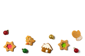 Gingerbread cookies with balls on white background. Christmas concept. Flat lay, top view. Copy space