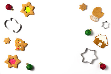 Gingerbread cookies with balls and cutters on white background. Christmas concept. Flat lay, top view. Copy space