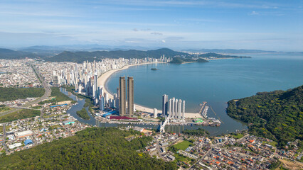 Panoramic view of Balneário Camboriú, featuring its beach and modern skyscrapers along the coastline.