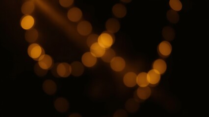 Fototapeta premium Enchanting Golden Bokeh Lights: Perfect for Holiday Decor, Romantic Ambiance, or Cozy Home Decor