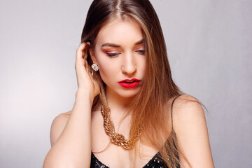 Gold earrings, ring and necklace.