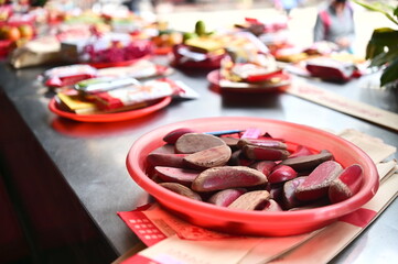 Taiwan - Jan 17, 2024: A close-up of a moon-shaped divination cup on a temple altar, showcasing the traditional Chinese ritual of casting lots for spiritual guidance and cultural significance.