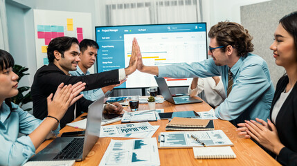 Cheerful meeting room, businesspeople celebrate with high fives and applause. Successful project was completed before the deadline, bringing joy and happiness to team. Habiliment