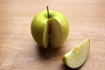green apples on wooden table