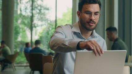 Indian Arabian man business guy satisfied businessman smile freelancer in cafe complete task laptop distant studying relax break accomplish stretch hands end work day relaxing drink coffee male rest