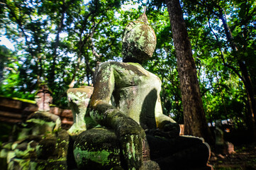 Sculpture of Old Stone Head Buddha , Symbols of Buddhism at Umong Temple, Chiang Mai, Northern Thailand