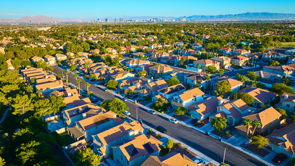 Aerial Suburban Las Vegas with Desert and Skyline at Sunset