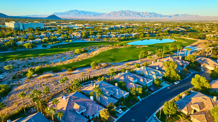 Aerial of Luxurious Suburban Neighborhood and Golf Course at Golden Hour