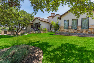 Beautiful residential home with lush greenery in a serene neighborhood setting