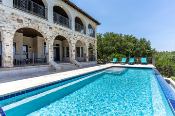 Luxurious stone villa with a stunning pool overlooking a beautiful landscape