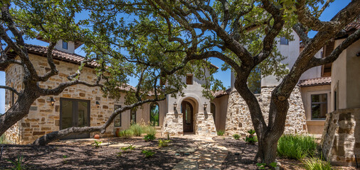 Tranquil courtyard showcasing rustic architecture and lush greenery