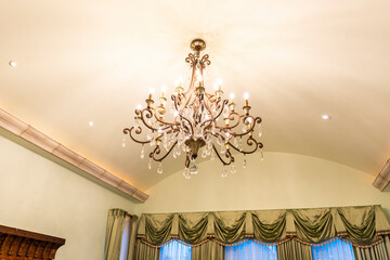 Elegant chandelier illuminating a beautifully designed room interior