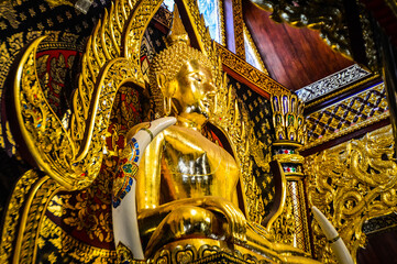 Golden Buddha statue, Architecture Lanna, Symbols of Buddhism at Muang Chiang Mai, Chiang Mai, Northern Thailand