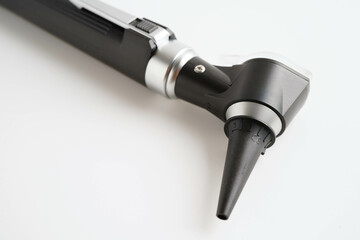 Otoscope isolated on white background for otolaryngologist or ENT physician doctor examining senior patient ear, hearing loss problem.