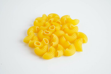 Pasta noodles for cooking Italian food in plastic bag on white background.