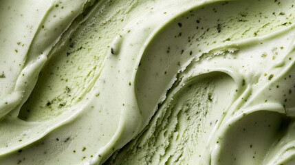 Fototapeta premium closeup of fresh matcha green tea ice cream texture, soft creamy surface, organic swirls pattern, artisanal gelato, fine granular detail, food photography, frosty cold dessert, mint sage color palette