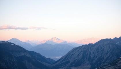 Naklejka premium Majestic Mountain Range at Sunrise Pastel Hues