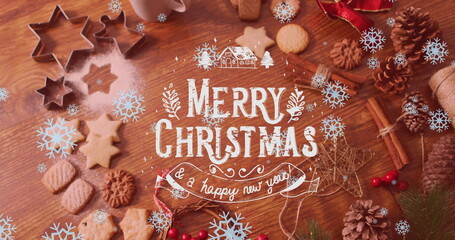 Image of merry christmas text over cookies