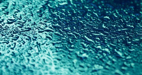 Dripping condensation. Water bubble. Sparkling colorful blue fluid rain gleaming blinking liquid on...