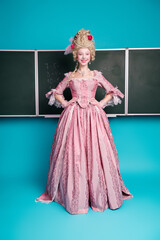 Photo of charming lady professor wear vintage pink dress math subject classroom isolated on blue color background