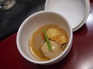 Japanese food oden fish cake dish in white ceramic bowl