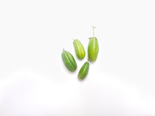 Averrhoa bilimbi, or Belimbing Wuluh or Belimbing Sayur is a type of star fruit on white. The fruit is native to Indonesia and the tropics. It tastes sour and is commonly used for seasoning dishes.