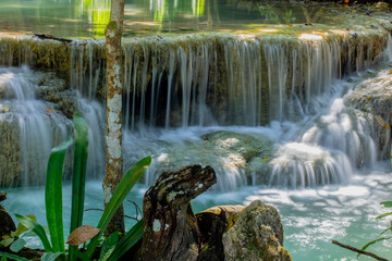 Scenic deep forest waterfalls at Erawan water falls national park, in Thailand