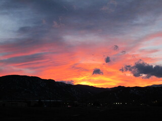 Orange sunset clouds over the Rocky Mountains, Boulder, Colorado