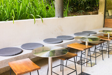 Circular metal table and chair at restaurant.