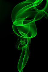 Green smoke abstract on black background for design. darkness concept