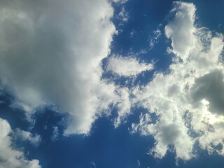 Obraz premium Image of apartments, sky, and clouds near Daecheongcheon walking trail