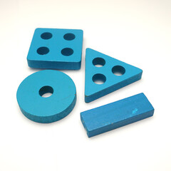 Stack of blue wooden block toys on white, educational creative fun games