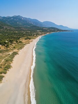 Aerial drone photo of famous big sand emerald sea beach or Megali Amos beach near seaside village of Marmari, South Evia island, Greece