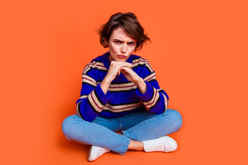 Photo portrait of young brown hair lady in blue striped cute sweater sitting floor deep thinking...