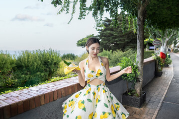 Fresh from farm woman grab yellow lemon sorbet gelato in Capri, Italy.