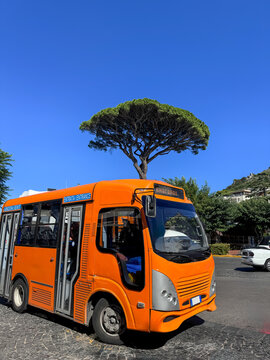 Orange public bus at the bus station in Anacapri Capri, Italy.