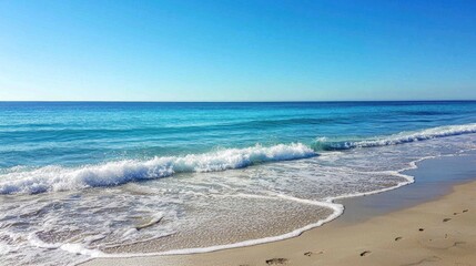 A calm, deep blue sea with gentle waves under a clear sky, stretching to the horizon