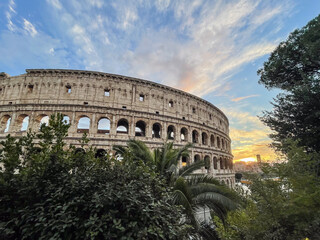 Arches archictecture of Colosseum (Colosseo) exterior with clouds and sky. Rome, Italy.