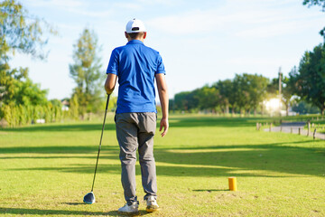 Fototapeta premium Asian man is playing golf in morning.