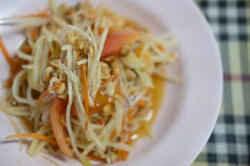 Thai Spicy green papaya salad. Famous Thai food