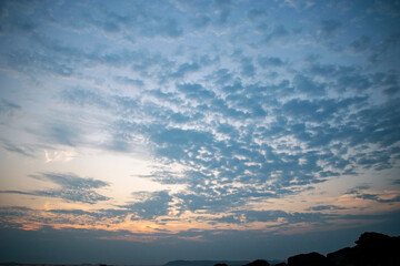 fluffy clouds after sunset