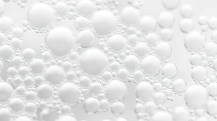 A minimalist soap foam bubbles texture, with fine, tiny bubbles spread across the background. The white bubbles have subtle translucency, creating a delicate and clean abstract look.