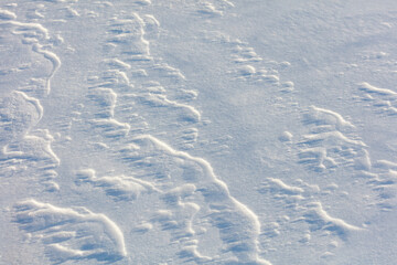 The snow is white and the ground is covered in it