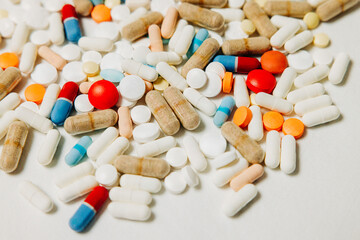 Flat lay macro photo of pills and capsules in variety of colors