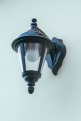 A black light fixture with a bulb inside